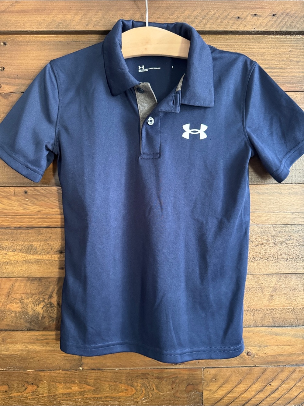 Under Armour youth navy blue performance polo size 6